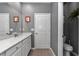 Bathroom featuring modern vanity with white countertop, a big mirror, and updated fixtures at 7369 Sw 77Th Ave, Ocala, FL 34481