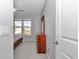Bedroom with a ceiling fan, dresser with mirror, and windows providing natural light at 7369 Sw 77Th Ave, Ocala, FL 34481