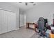 Minimal bedroom with wood-style tile floors, closet, and ceiling fan at 7369 Sw 77Th Ave, Ocala, FL 34481