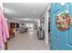 Open-concept home featuring a long entryway with views of the living room and dining area at 7369 Sw 77Th Ave, Ocala, FL 34481