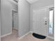 Bright entryway with neutral paint, tile flooring, and natural light from the sidelight window at 7369 Sw 77Th Ave, Ocala, FL 34481
