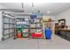 Well-organized garage with shelving, toolboxes, and epoxy floors at 7369 Sw 77Th Ave, Ocala, FL 34481