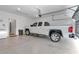 Clean and spacious garage with car, storage cabinet, and indoor access at 7369 Sw 77Th Ave, Ocala, FL 34481