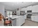Bright kitchen with stainless appliances, center island, and stylish countertops at 7369 Sw 77Th Ave, Ocala, FL 34481