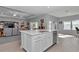 Open concept kitchen with an island, stainless steel appliances, and access to the living room at 7369 Sw 77Th Ave, Ocala, FL 34481
