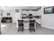 Modern kitchen featuring a center island with bar seating, stainless steel appliances, and white cabinets at 7369 Sw 77Th Ave, Ocala, FL 34481