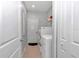 Clean laundry room with a washer, dryer, and shelving for storage at 7369 Sw 77Th Ave, Ocala, FL 34481