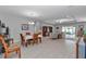 Bright and airy open-concept living room and dining area featuring wood floors and recessed lighting at 7369 Sw 77Th Ave, Ocala, FL 34481