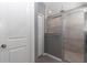 Bathroom with a tiled shower with a glass enclosure at 7369 Sw 77Th Ave, Ocala, FL 34481