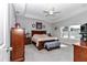 Spacious main bedroom with a ceiling fan, carpeted floor, and plenty of natural light from the windows at 7369 Sw 77Th Ave, Ocala, FL 34481