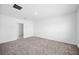 Spacious bedroom features neutral carpeting, ample natural light, and a connecting door at 752 Trotters Dr, Eagle Lake, FL 33839