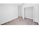 Neutral bedroom featuring carpet, closet, and bright doorway at 752 Trotters Dr, Eagle Lake, FL 33839