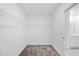 Walk-in closet featuring neutral carpet, wire shelving, and bright doorway at 752 Trotters Dr, Eagle Lake, FL 33839