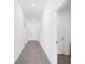 Bright hallway featuring tile flooring, neutral paint, and recessed lighting, providing a clean and modern look at 752 Trotters Dr, Eagle Lake, FL 33839