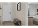 Entryway featuring a stylish bench with wallpaper and view of the bedroom at 831 Retreat Blvd # 103, Davenport, FL 33897