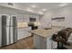 Modern kitchen with granite countertops, stainless steel appliances, and bar seating at 831 Retreat Blvd # 103, Davenport, FL 33897