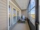 Relaxing screened porch with seating and a view at 831 Retreat Blvd # 103, Davenport, FL 33897