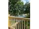 Scenic balcony view overlooking lush greenery, mature trees, and a serene pond with inviting pathways at 8843 Villa View Cir # 14-205, Orlando, FL 32821