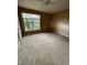 Bedroom featuring carpet, a ceiling fan, and window with natural light at 8843 Villa View Cir # 14-205, Orlando, FL 32821