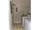 Efficient laundry area features a washing machine, dryer, and overhead shelving for optimal storage solutions at 8843 Villa View Cir # 14-205, Orlando, FL 32821