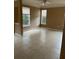 Living room with tile floor, two windows and neutral colored walls at 8843 Villa View Cir # 14-205, Orlando, FL 32821