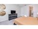 Relaxing bedroom with comfortable furnishings, television, and access to an ensuite bathroom at 9033 Flamingo Key Way, Kissimmee, FL 34747
