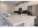 Bright kitchen featuring an expansive island, modern appliances, and sleek white cabinetry at 9033 Flamingo Key Way, Kissimmee, FL 34747