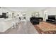Open-concept space boasting a modern kitchen, dining area, and inviting living room layout at 9033 Flamingo Key Way, Kissimmee, FL 34747