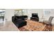 Inviting living room with tile flooring, stylish furniture, and view of backyard pool area at 9033 Flamingo Key Way, Kissimmee, FL 34747