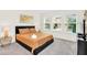 Cozy main bedroom featuring ample natural light, comfortable bed, and stylish decor at 9033 Flamingo Key Way, Kissimmee, FL 34747