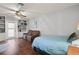 Living space with built-in shelving, a ceiling fan, and a comfortable bed at 942 Cinnamon Ct, Altamonte Springs, FL 32714