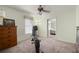 Neutral bedroom featuring a ceiling fan, dresser, and a window at 942 Cinnamon Ct, Altamonte Springs, FL 32714