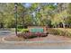 Welcoming entrance to The Trails at Country Creek, enhanced by beautiful landscaping and lush greenery at 942 Cinnamon Ct, Altamonte Springs, FL 32714