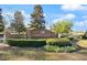 Scenic view of the brick entrance to the Country Creek community, featuring manicured landscaping and vibrant floral accents at 942 Cinnamon Ct, Altamonte Springs, FL 32714