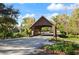 Charming covered bridge over a tree-lined street, providing a picturesque entryway into the community at 942 Cinnamon Ct, Altamonte Springs, FL 32714