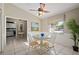 Inviting dining area with tile floors, a round table, and a view into the living spaces at 942 Cinnamon Ct, Altamonte Springs, FL 32714