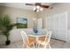 Cozy dining area featuring a round table, wood chairs, tiled floors, and natural light at 942 Cinnamon Ct, Altamonte Springs, FL 32714