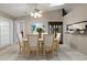 The dining room features a neutral color palette, and a view of the kitchen at 942 Cinnamon Ct, Altamonte Springs, FL 32714