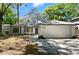 Charming single-story home boasts a well-manicured lawn, mature trees, and an attached two-car garage at 942 Cinnamon Ct, Altamonte Springs, FL 32714