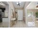 Welcoming foyer with neutral tones, tile flooring, decorative mirror, and views into adjacent rooms at 942 Cinnamon Ct, Altamonte Springs, FL 32714
