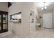 Hallway view showcasing the architectural design, with views to the kitchen and front door at 942 Cinnamon Ct, Altamonte Springs, FL 32714