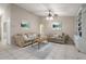 Comfortable living room with tile flooring, sofas, area rug, built-in shelving, and natural lighting at 942 Cinnamon Ct, Altamonte Springs, FL 32714
