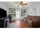 Comfortable living room with built-in shelving and an entertainment center at 942 Cinnamon Ct, Altamonte Springs, FL 32714