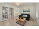Sunroom with french doors leading to dining room provides flex space for a cozy living room at 942 Cinnamon Ct, Altamonte Springs, FL 32714