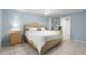 The main bedroom features a ceiling fan and a view of an ensuite bathroom at 942 Cinnamon Ct, Altamonte Springs, FL 32714