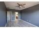 Bedroom with hardwood floors and an ensuite bathroom at 9620 Doris Ln, Orlando, FL 32829