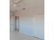 Bright bedroom featuring neutral walls, plush carpeting, ceiling fan, and a closet at 9620 Doris Ln, Orlando, FL 32829