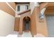 Close-up of a home's arched doorway and neutral exterior, complete with a charming wreath at 9620 Doris Ln, Orlando, FL 32829