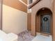 Charming home entrance with a decorative wreath, creating a welcoming and inviting entryway at 9620 Doris Ln, Orlando, FL 32829
