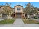 Charming townhome featuring a two-car garage and well-manicured landscaping for a welcoming curb appeal at 9620 Doris Ln, Orlando, FL 32829